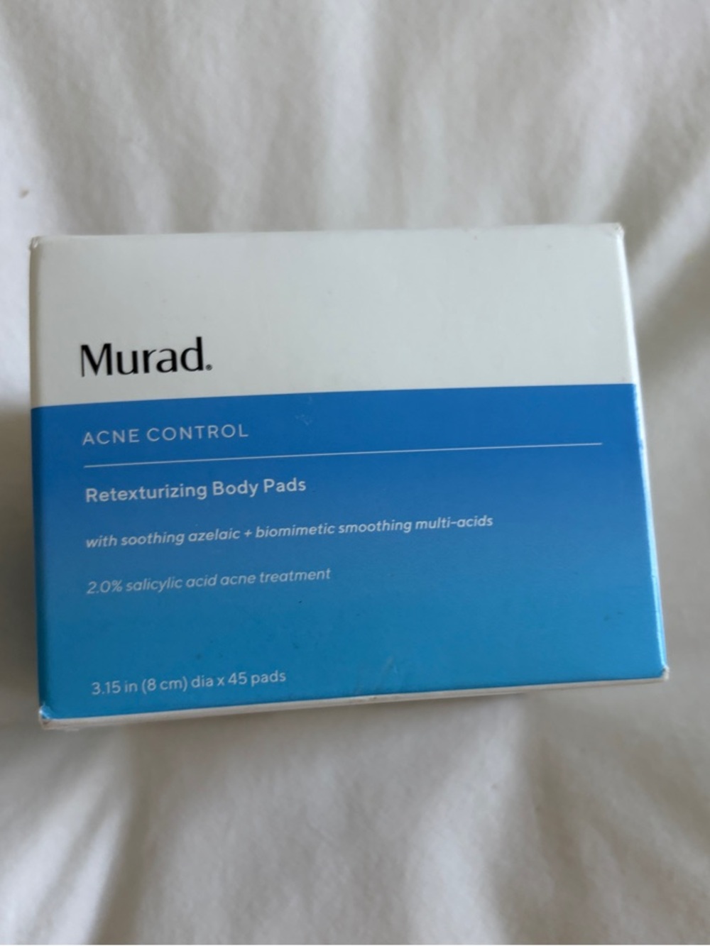 Murad Retexturizing Body Pads in blue and white